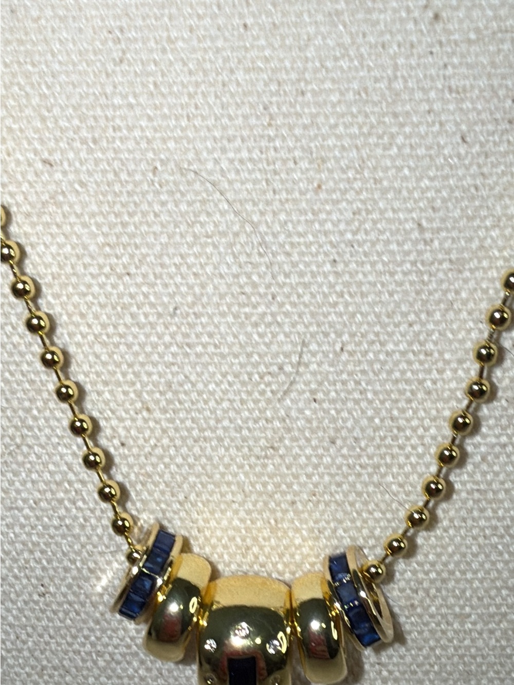 Gorgeous gold plated 24 inch ball chain with simulated blue sapphires and gold